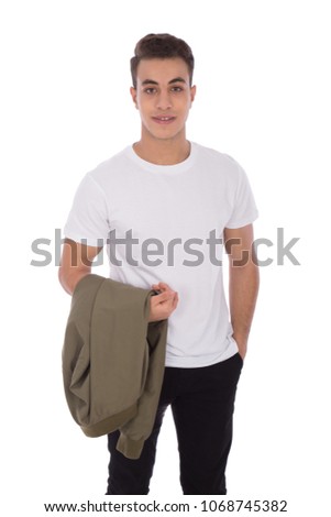 Handsome young man wearing a casual outfit, holding his jacket in his hand, isolated on white background