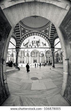 Inside the walls of a traditional Turkish Mosque, wide fish-eye view vertical picture