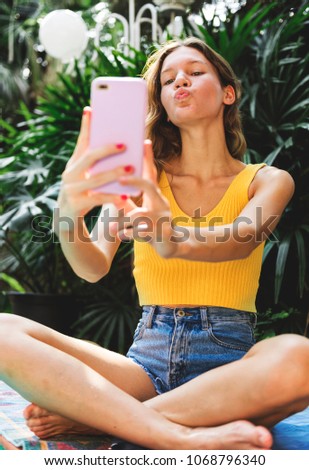 Girl taking a selfie in summertime