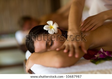 A young woman having massage in tropical spa Royalty-Free Stock Photo #10687987