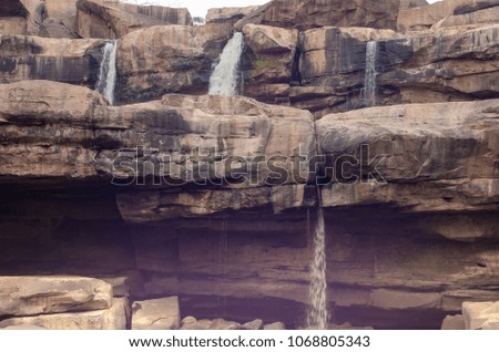 Cliff and waterfall in summer,Tropical forest in Thailand,some of water will be big waterfall in rainy season