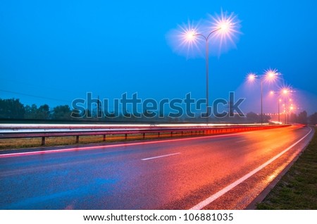 Evening road with lampposts