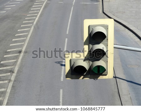 Green traffic light over empty multiband highway