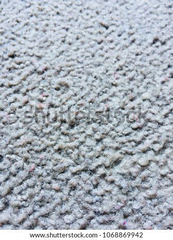 Carpet rug flooring textured detail, folds in textile fabric.