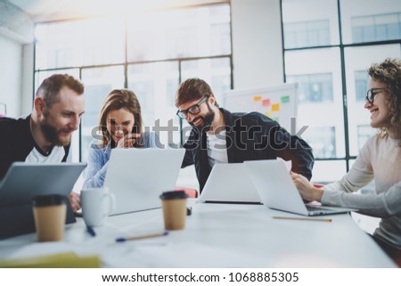 Project team working together in meeting room at office.Coworkers brainstorming process concept.Horizontal.Blurred background.