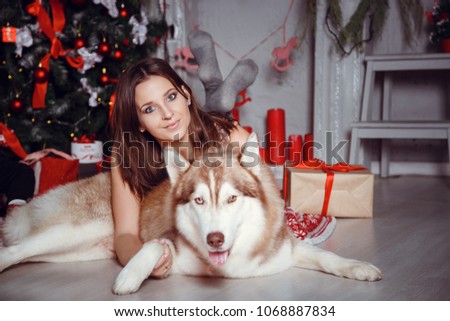 Family with dog in an interior. Happy Mother Children and Animal celebrating. emotional moments. merry christmas and happy new year concept. space for text