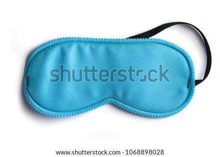 Blue sleeping eye mask, isolated on white background Royalty-Free Stock Photo #1068898028