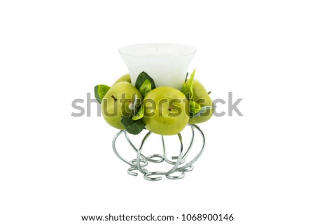 Candle holder with decorative green apples isolated on white background