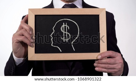 Dollar symbol head image on blackboard in businessman hands, greed for money, stock footage