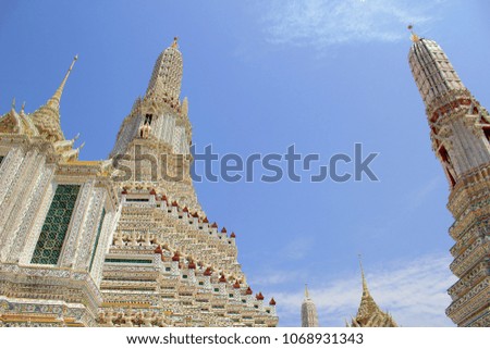 The scenery inside Wat Arun com pagoda, both small and big white background bright sky.