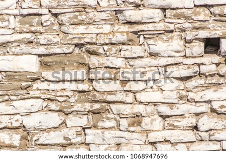 Old wall made of white stone, background and texture