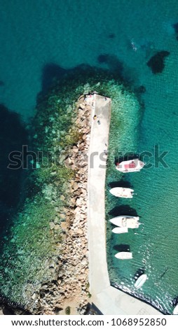 Aerial drone bird's eye view photo of tropical port with turquoise clear waters