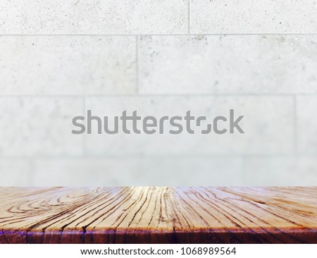 Wood table top on blurred gray, white, brown marble background - can be used for display or montage your products.