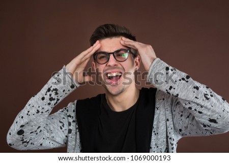 man screaming mouth open, hold head hand, isolated background, concept face emotion