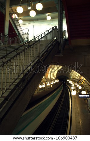 Paris subway station with motion blurred train