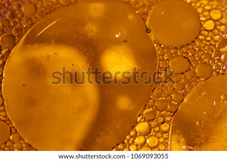 Droplets of oil floating on water
