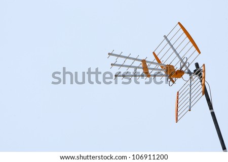 Television antenna home receiver on a bright sky