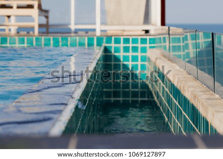 Swimming pool, overflowing water.