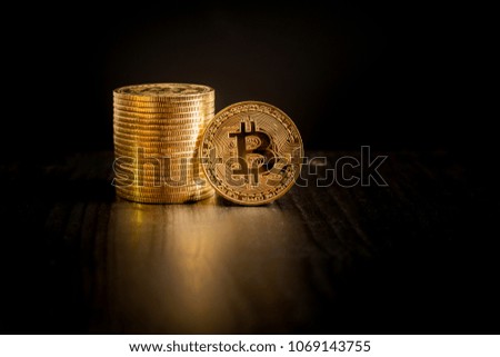  Bitcoin coins on black background 