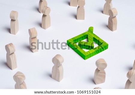 People gathered around the checkbox on a white background. People make a group choice. Democratic elections, collective decision and choice, referendum. Concept forum of people. Green Check mark Royalty-Free Stock Photo #1069151024
