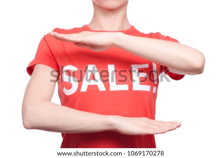 Woman with t-shirt with an inscription sale shop buy discount on a white background isolation