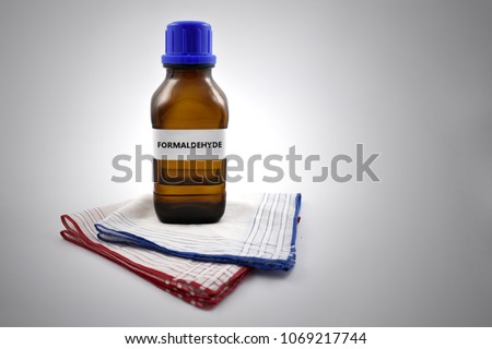 A bottle of formalin with inscription. Formaldehyde and handkerchief Royalty-Free Stock Photo #1069217744