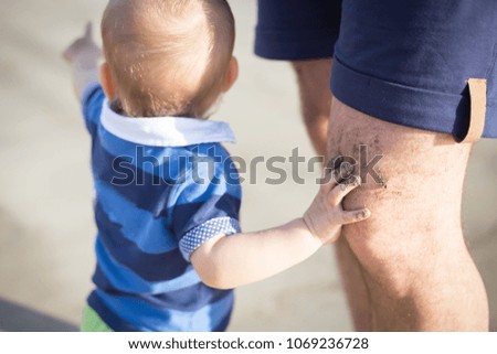 baby on the beach with a father, vacations with a baby