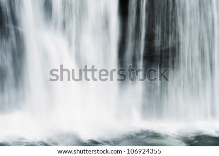 Abstract of flowing water from a waterfall.