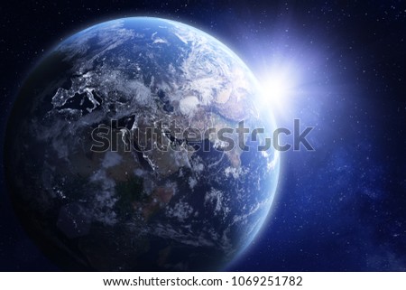 3D render of planet Earth viewed from space, with night lights in Europe and sun rising over Asia. Blue hue treatment. Elements from NASA Royalty-Free Stock Photo #1069251782