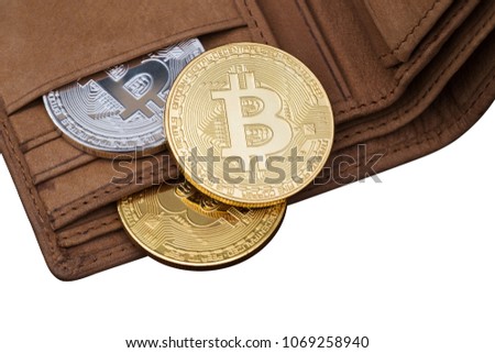 Metal bitcoins in brown leather wallet with white copyspace