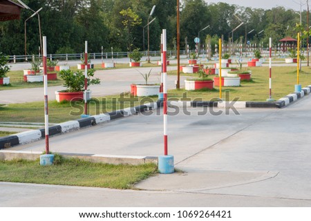 Driving School Practice Parking Area with Red Pole Sign