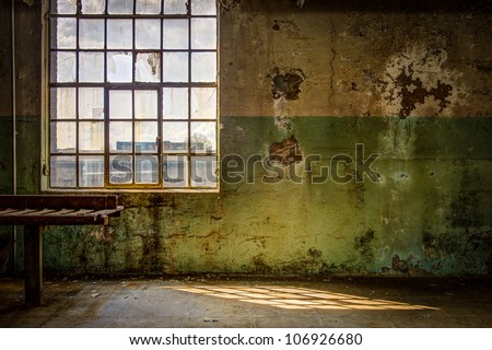 Old and dirty wall of the interior of an out of order factory Royalty-Free Stock Photo #106926680