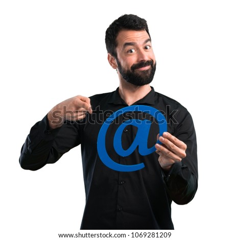 Handsome man with beard holding icon of at dot com on white background