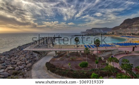 Sunset on the beach Royalty-Free Stock Photo #1069319339
