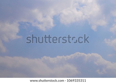 The softlybeautiful blue sky and grey cloud background. 