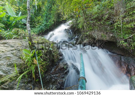 Rainbow Waterfall ,in the forest tropical zone ,national park Takua pa Phang Nga Thailand
