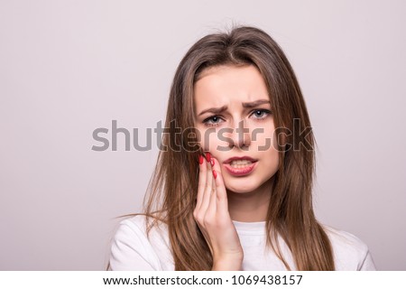 woman suffering from toothache, tooth decay or sensitivity Royalty-Free Stock Photo #1069438157