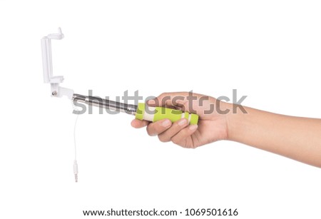 hand holding selfie stick with an adjustable clamp isolated on a white background
