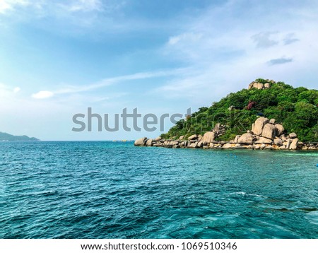 An island picture with clear sea water background. Image picture