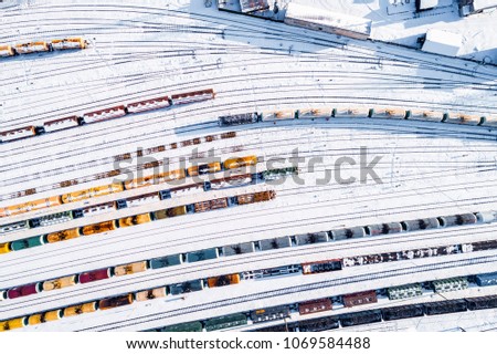 Train depot from above, long colourful train sets, sunny day in winter. Located in Jelgava, Latvia.