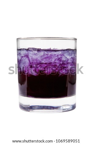 A one-color, purple clear cocktail in a low glass with crushed ice frappe. Side view. Isolated white background. Drink for the menu restaurant, bar, cafe Royalty-Free Stock Photo #1069589051