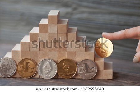 Bitcoin gold coin and wooden background. Virtual cryptocurrency concept. bitcoin growth. success of the crypto currency