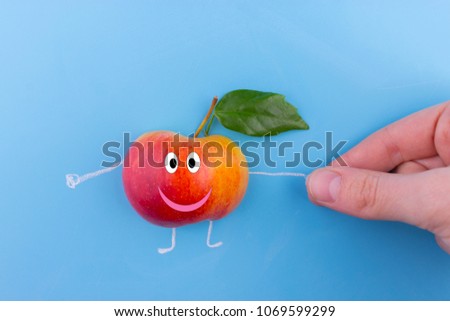 Funny apple character. apple holding hands with human