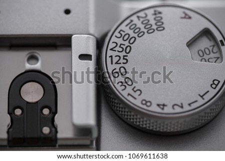 shutter speed dial and flash hotshoe of vintage camera, shallow depth of field, old film look effect
