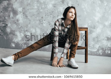 girl, photo in studio, girl sitting on a stand
