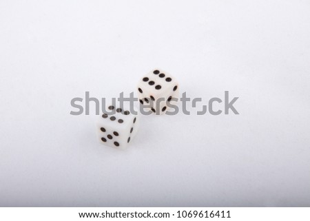 Two white dice cubes showing six on white background. High angle view with copy space