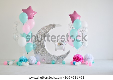 Decorations for holiday party. A lot of balloons blue pink and white colors.