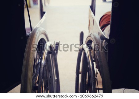 close up wheel of wheelchair in hospital, healthcare technology concept, vintage tone