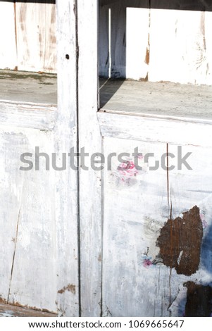 Detail of vintage wooden cupboard with floral and mail stamps
