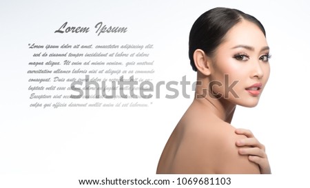Beauty shot of young pretty asian woman with clear skin ongrey background, for skin ad and cosmetology with copy space for text insertion